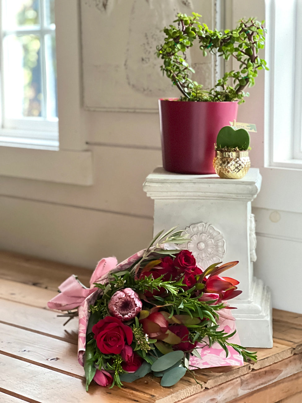 red roses, pink protea, wrapped bouquet, Valentine's Day flowers, heart plant, hoya heart