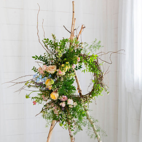 handmade wreath with pastel flowers for funeral