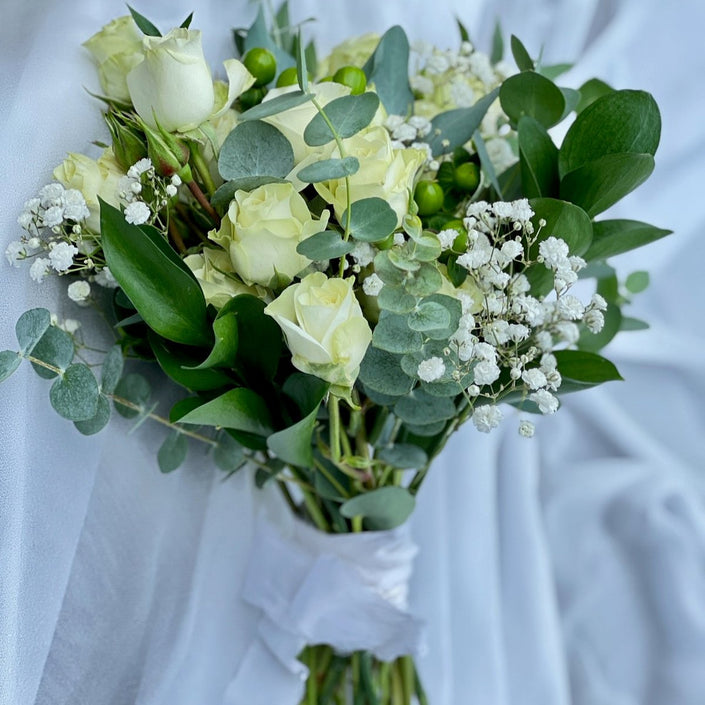 small flowers wrapped into a handtied bouquet to carry