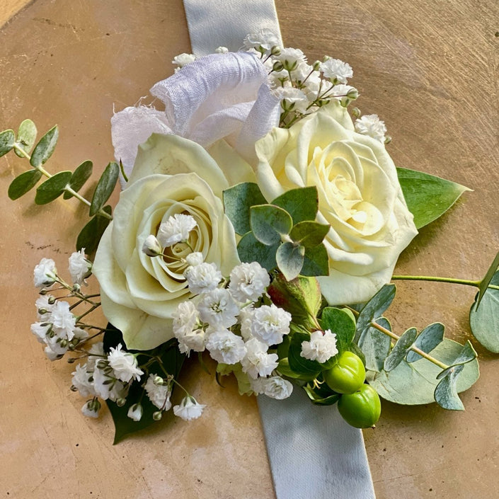 classic wrist corsage with greenery