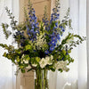 designers choice arrangement in tall glass vase