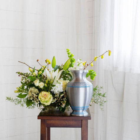 white flowers with greenery for funeral or sympathy