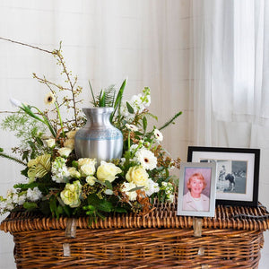 white urn wreath arrangement